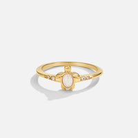 Opal Gold Turtle Ring, gold ring with a turtle front set with white opal, on white background